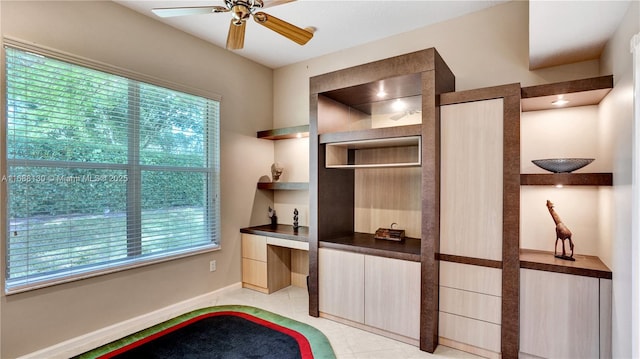 office area with ceiling fan and built in features