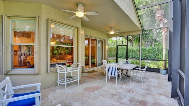 sunroom featuring ceiling fan