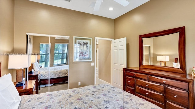 bedroom with ceiling fan and a closet