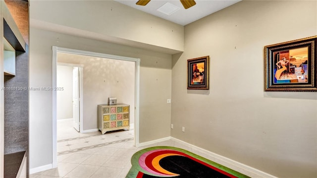 playroom featuring ceiling fan and light tile patterned floors