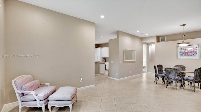 sitting room with light tile patterned floors