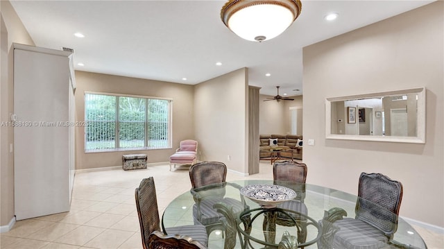 dining room with ceiling fan and light tile patterned flooring