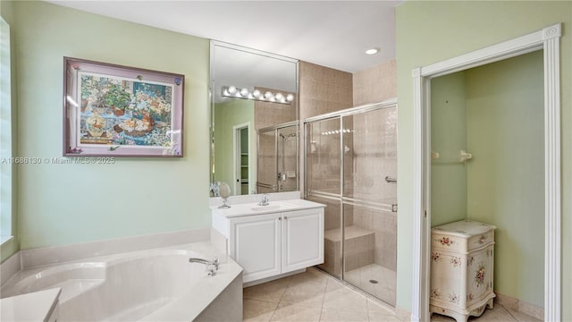 bathroom featuring tile patterned flooring, vanity, and independent shower and bath