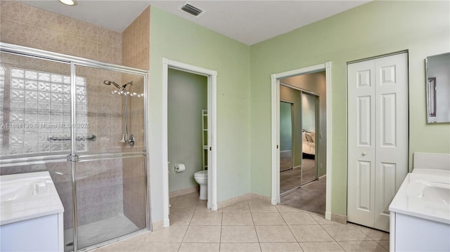 bathroom with vanity, toilet, and walk in shower