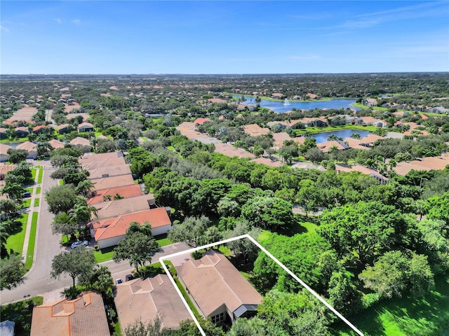 drone / aerial view with a water view