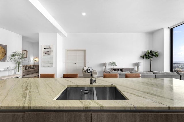 kitchen featuring sink and a wall of windows