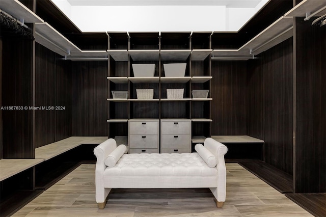 walk in closet featuring light hardwood / wood-style flooring