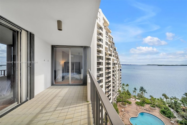 balcony featuring a water view