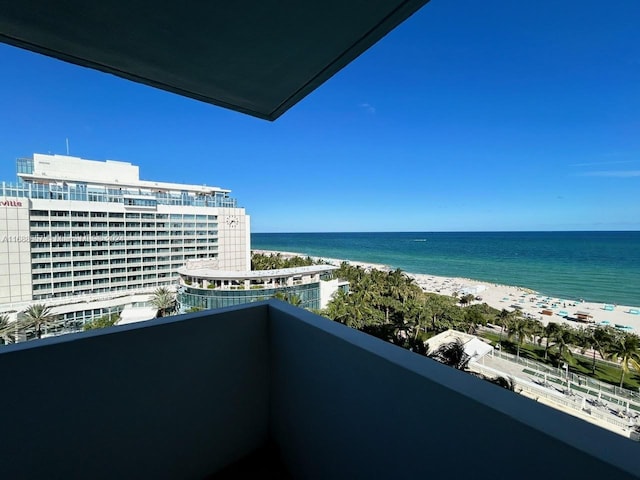 balcony with a view of the beach and a water view