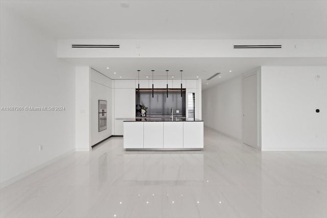 kitchen featuring white cabinets