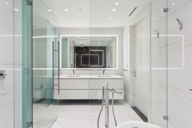 bathroom featuring walk in shower and vanity