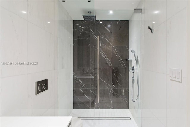 bathroom with a tile shower