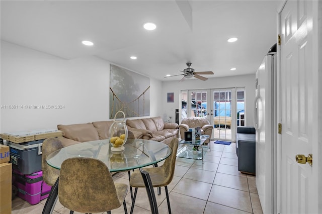 tiled living room featuring french doors and ceiling fan