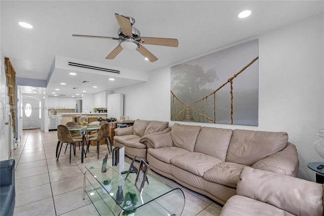 tiled living room with ceiling fan