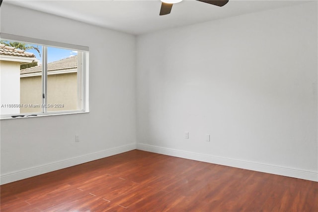 empty room featuring wood-type flooring and ceiling fan