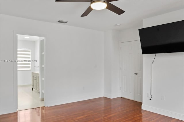 unfurnished room featuring hardwood / wood-style floors and ceiling fan