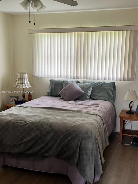 bedroom featuring hardwood / wood-style flooring and ceiling fan