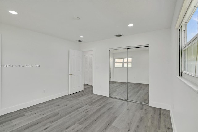 unfurnished bedroom featuring light hardwood / wood-style flooring