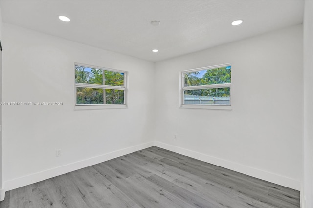 empty room with wood-type flooring