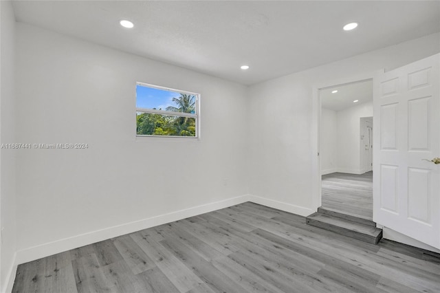 unfurnished room with light hardwood / wood-style floors