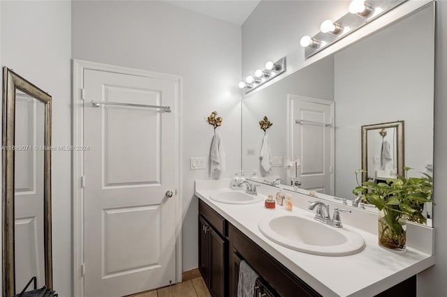 bathroom with tile patterned flooring and vanity