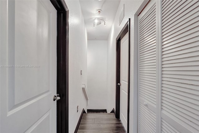 hallway featuring dark hardwood / wood-style floors