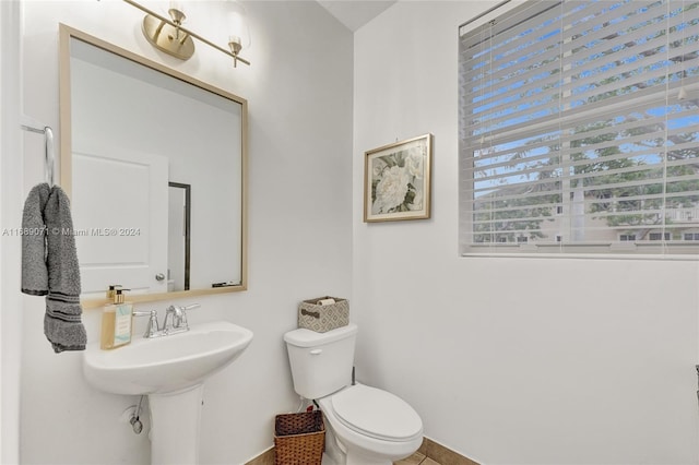 bathroom with tile patterned flooring and toilet