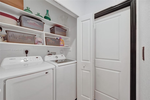 laundry room with independent washer and dryer