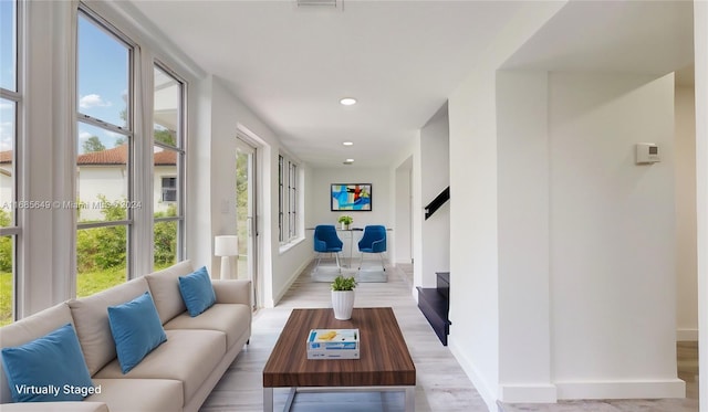 corridor featuring light hardwood / wood-style floors