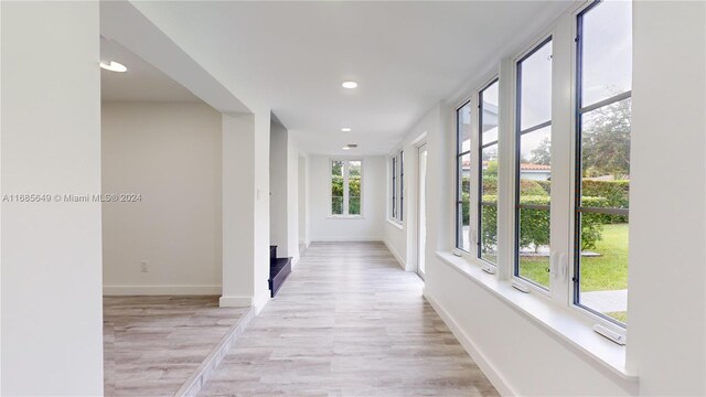 837 El Rado St, Coral Gables, FL 33134 - hallway with light wood-style floors, recessed lighting, and baseboards