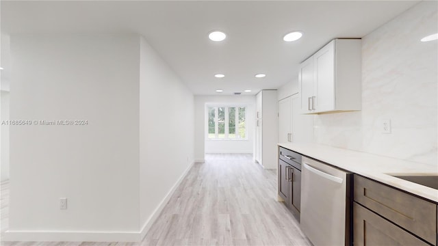 kitchen featuring dishwasher, light hardwood / wood-style floors, and white cabinets