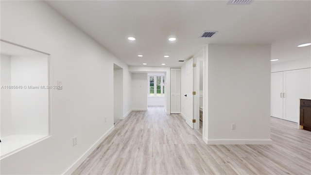 corridor featuring light hardwood / wood-style floors