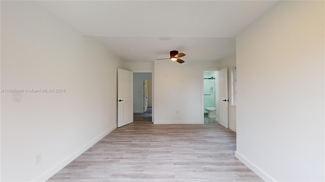 spare room featuring ceiling fan and light hardwood / wood-style flooring