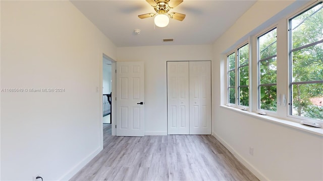 837 El Rado St, Coral Gables, FL 33134 - unfurnished bedroom with light wood-style flooring, multiple windows, and baseboards