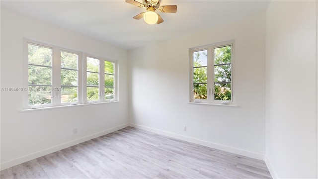 empty room featuring light hardwood / wood-style flooring and ceiling fan