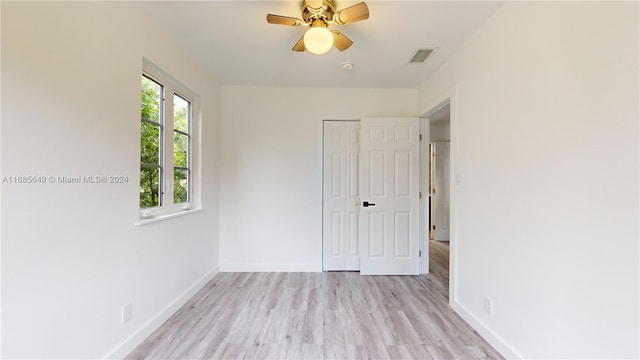 unfurnished bedroom with a closet, ceiling fan, and light hardwood / wood-style flooring