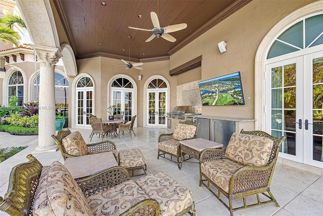 view of patio featuring an outdoor kitchen, french doors, ceiling fan, and a grill