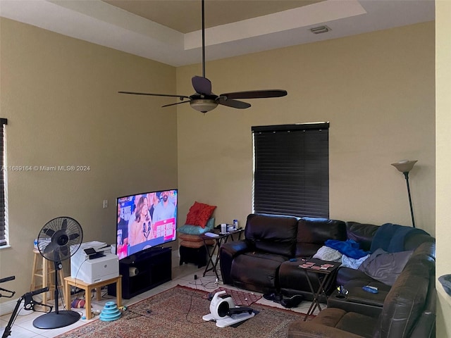 tiled living room with ceiling fan