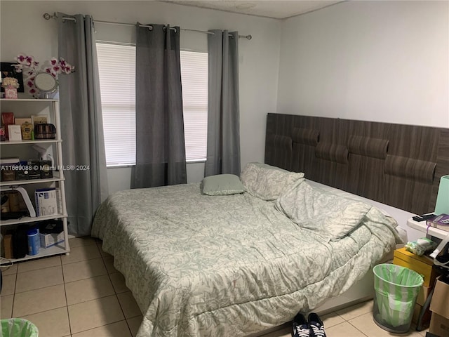 bedroom with light tile patterned flooring