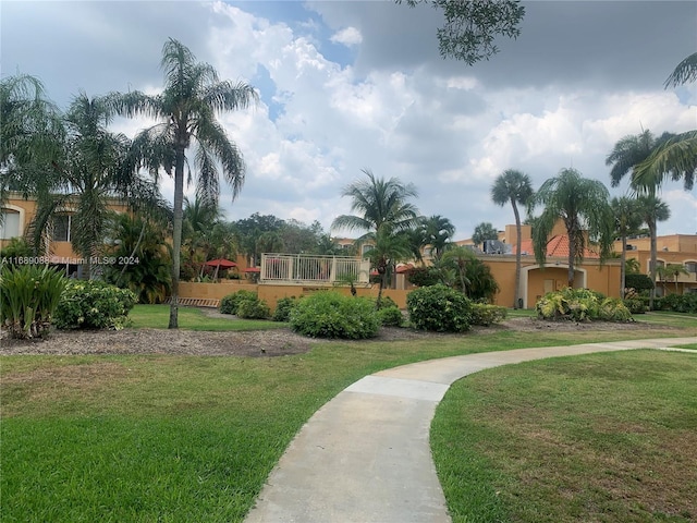 view of home's community featuring a lawn