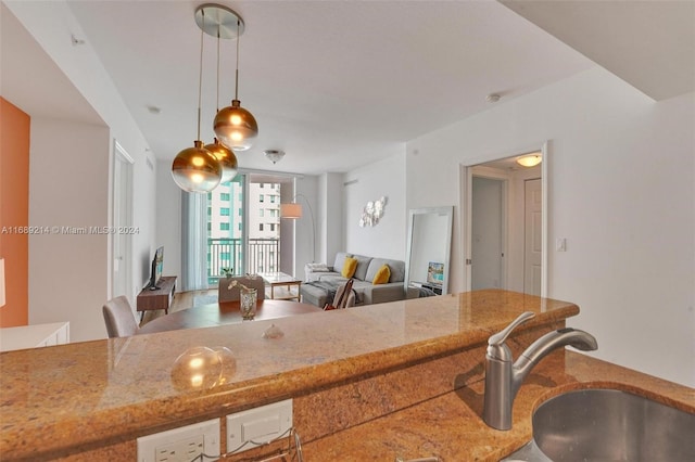 kitchen with hanging light fixtures and sink