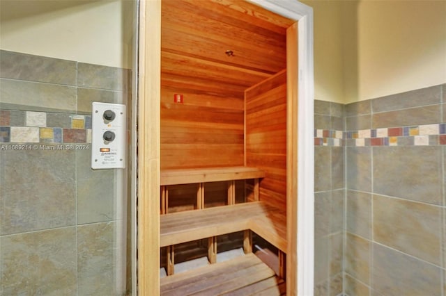 view of sauna with wooden walls and wooden ceiling