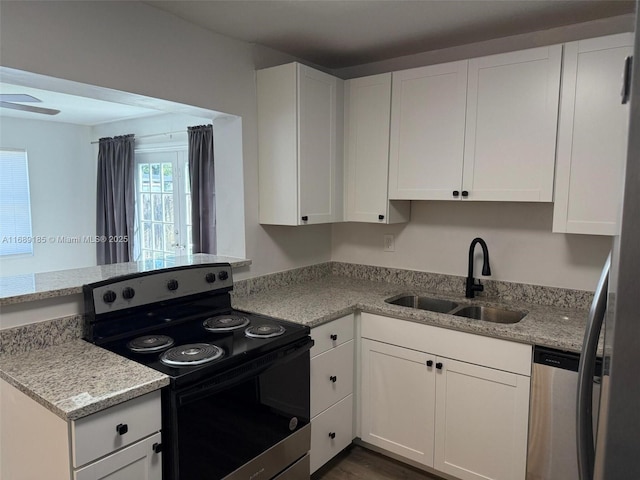 kitchen with white cabinets, sink, and appliances with stainless steel finishes