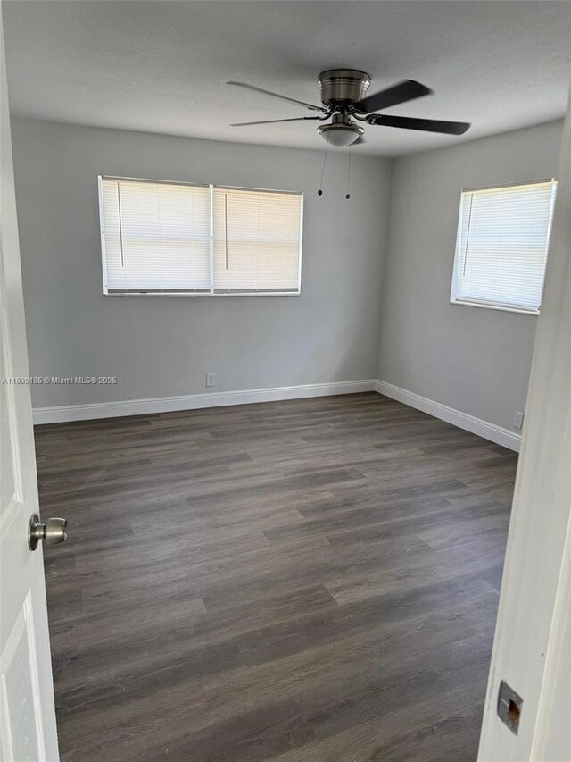 full bathroom with vanity, a healthy amount of sunlight, tiled shower / bath combo, and toilet