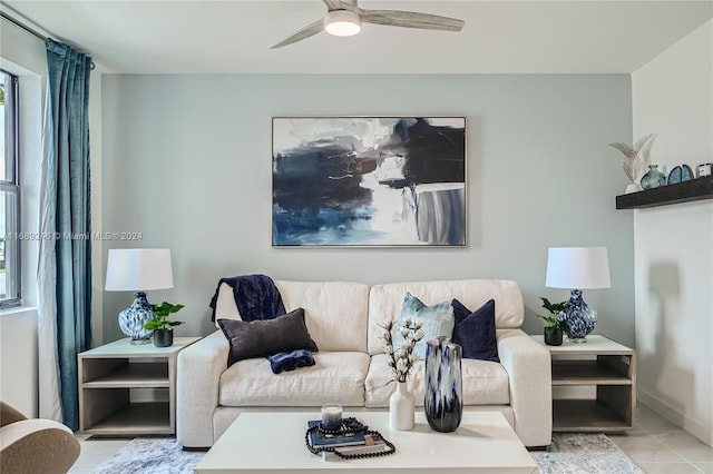 tiled living room with ceiling fan