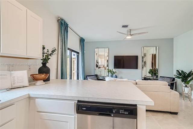 kitchen featuring dishwasher, light tile patterned floors, ceiling fan, and white cabinets