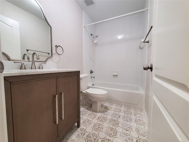 full bathroom featuring tiled shower / bath, toilet, and vanity