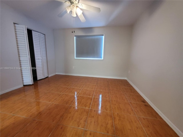 unfurnished bedroom with a closet and ceiling fan