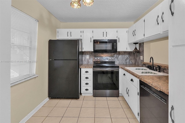 kitchen featuring tasteful backsplash, white cabinetry, sink, and black appliances