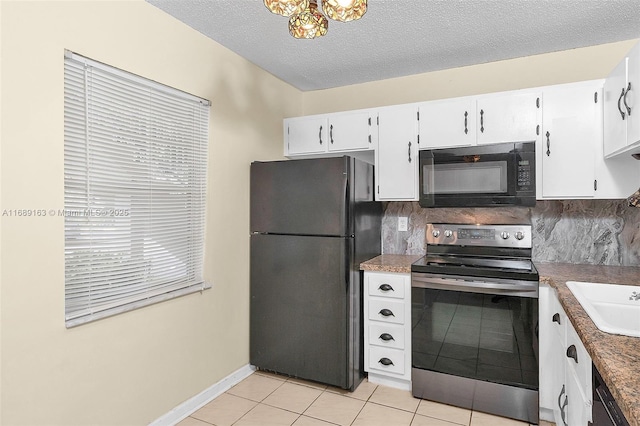 kitchen featuring white cabinetry, tasteful backsplash, black appliances, a textured ceiling, and light tile patterned flooring